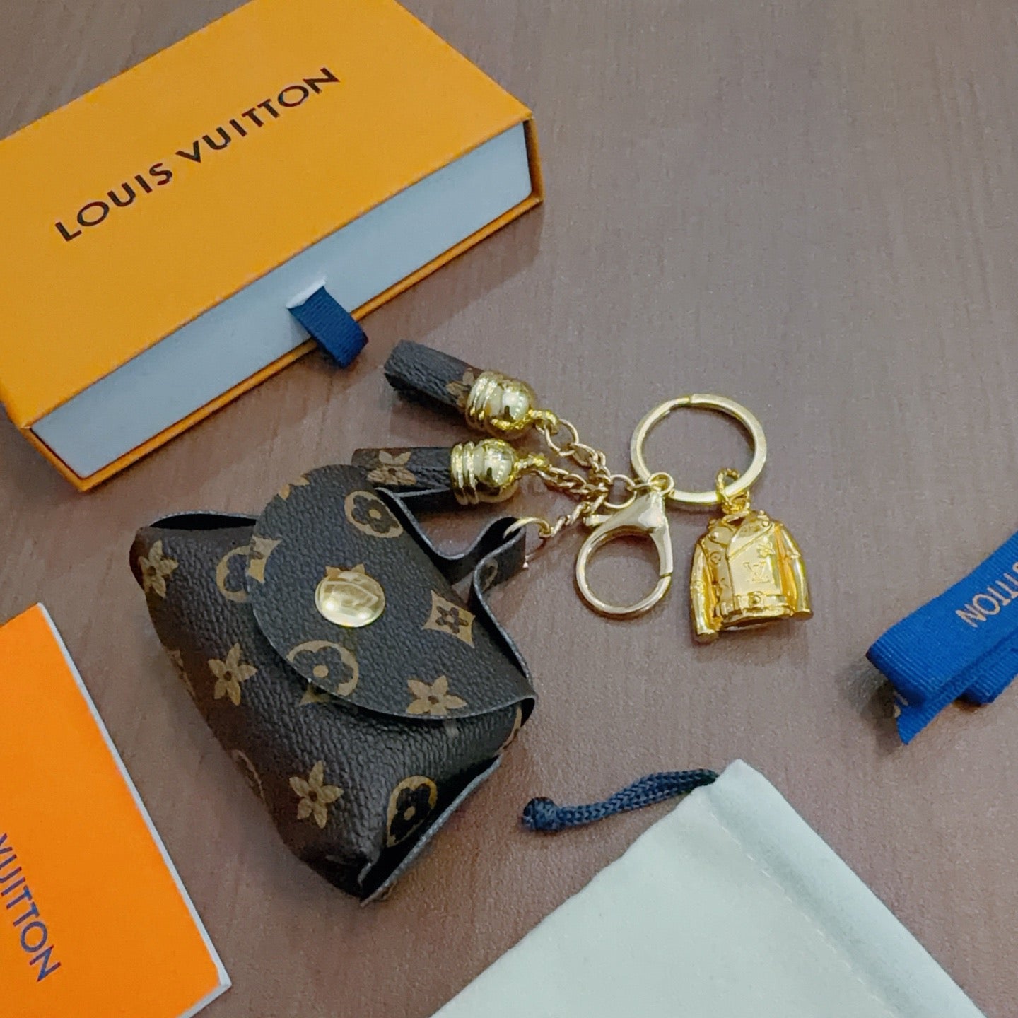 LV Brown and Beige Bag Charm With Gold Cup