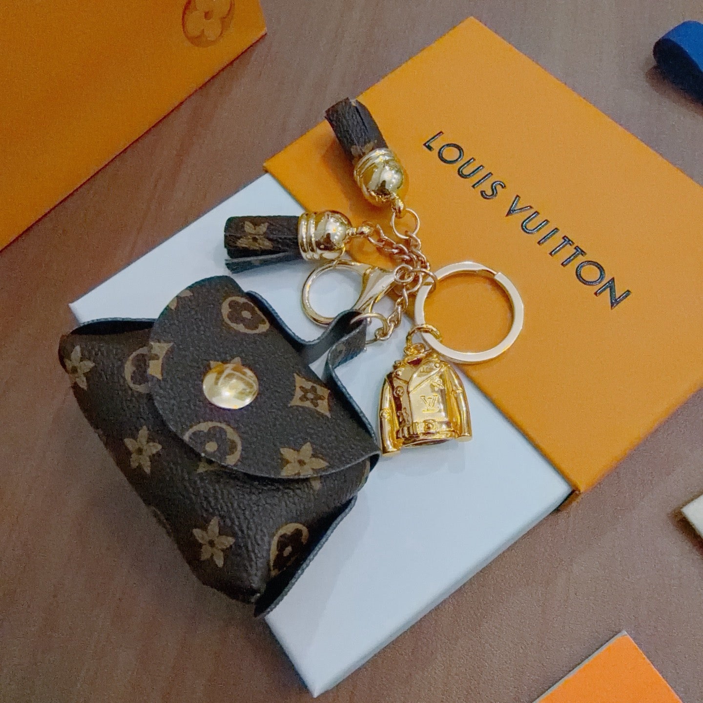LV Brown and Beige Bag Charm With Gold Cup