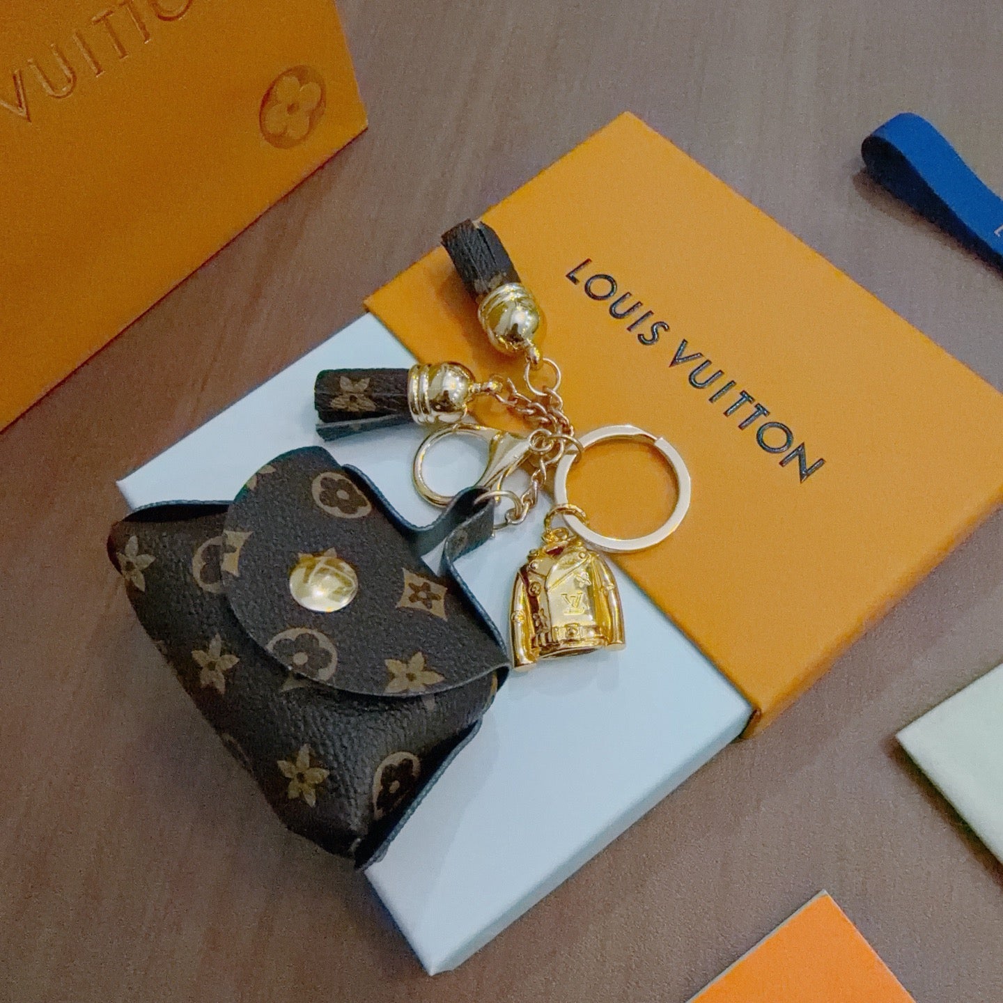 LV Brown and Beige Bag Charm With Gold Cup