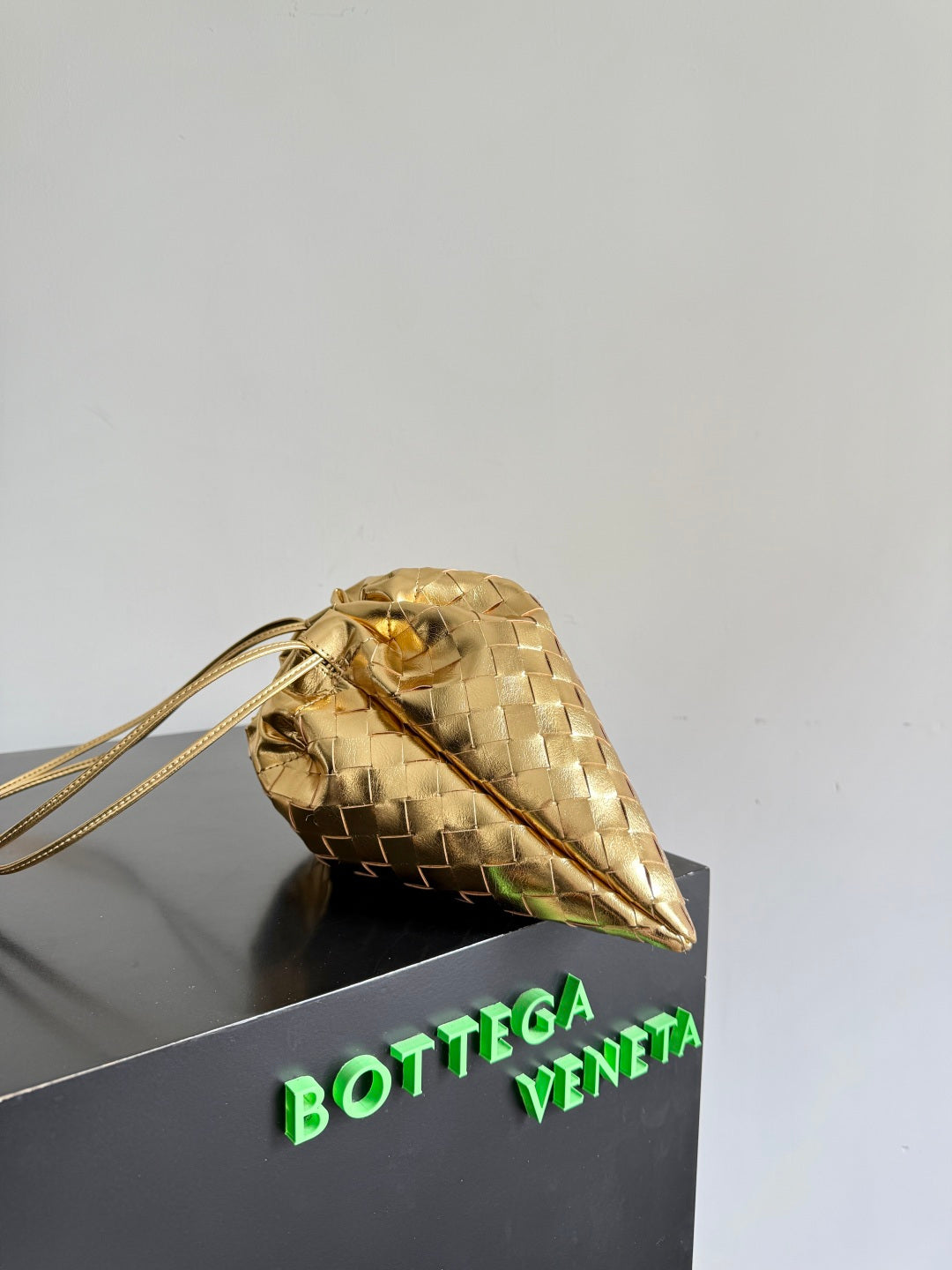 Bottega Veneta 2026 Dust Bag Gold Laminated Leather