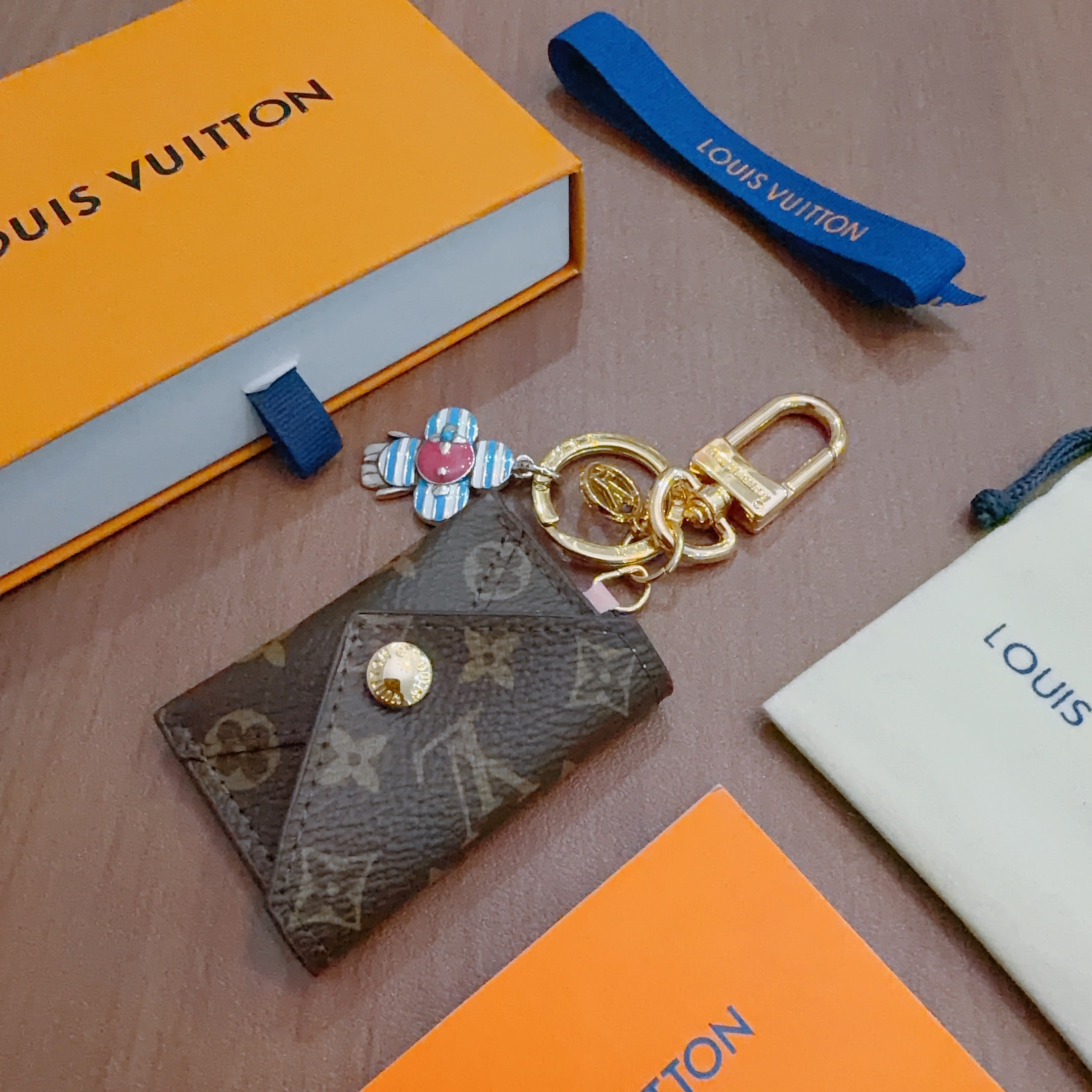 LV Brown Bag Charm With Blue Flower