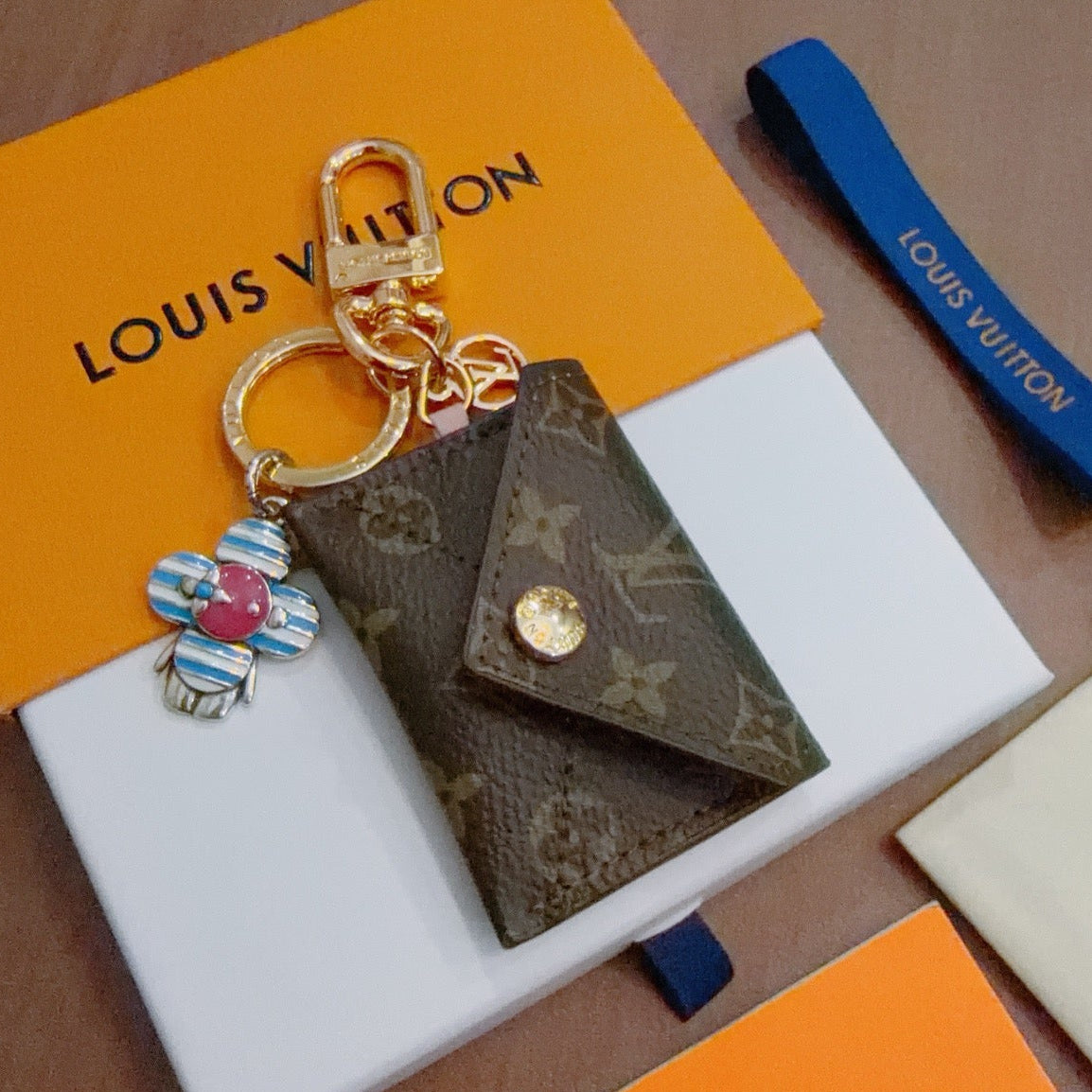 LV Brown Bag Charm With Blue Flower
