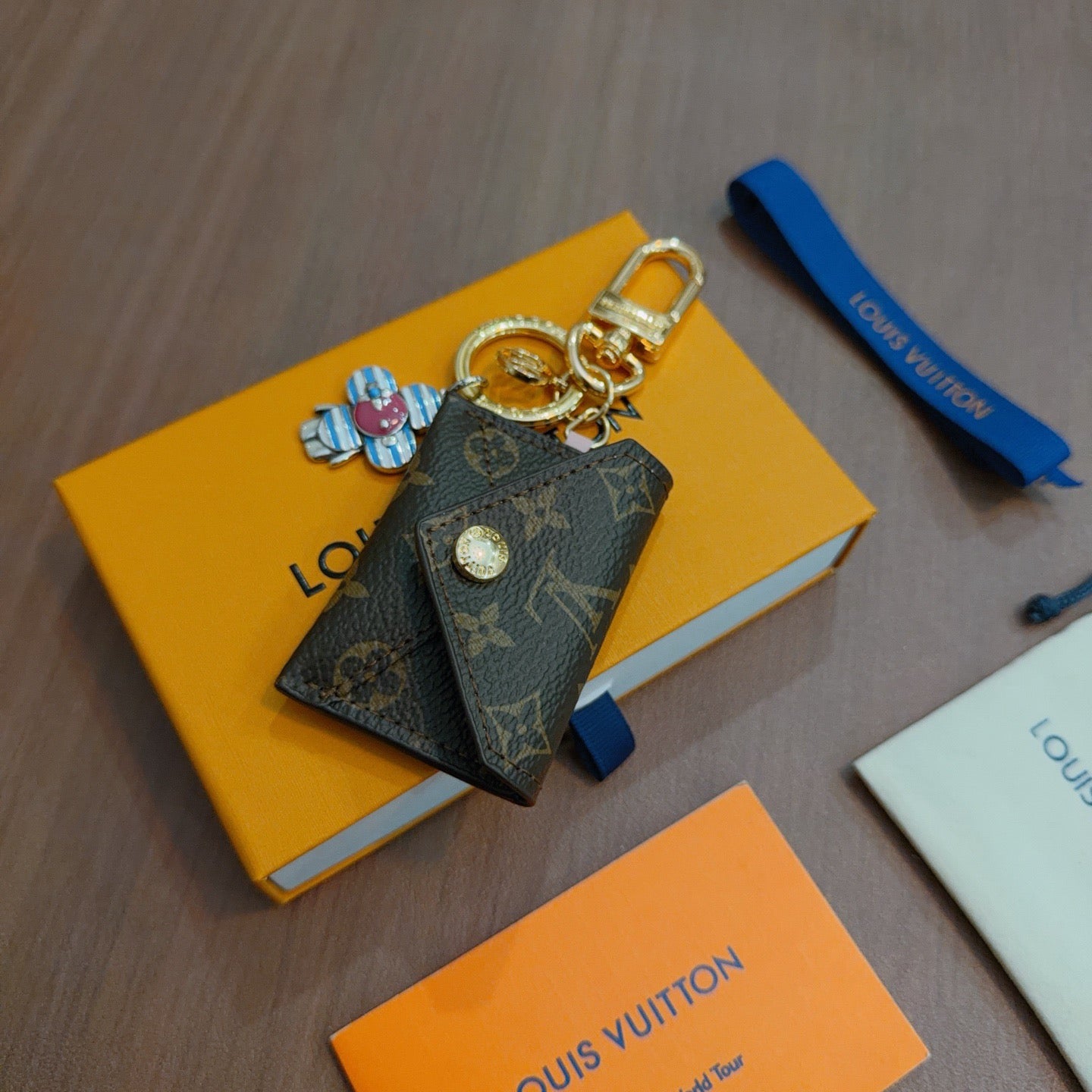 LV Brown Bag Charm With Blue Flower